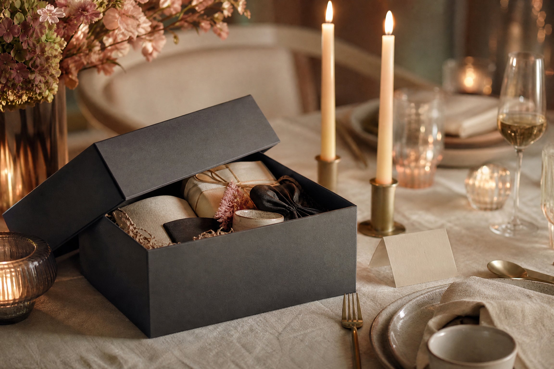 An intimate cream linen table set for a gifting occasion